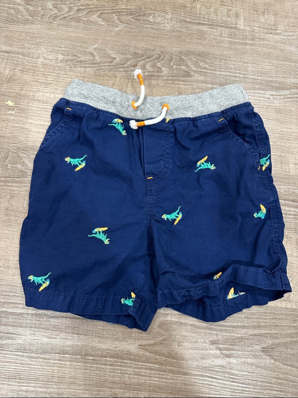 Mini Boden Navy Shorts with Embroidered Surfing Dinosaurs
